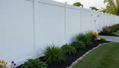 White privacy fence installation by Chop Chop Landscaping in Arlington, TX with clean, professional finish